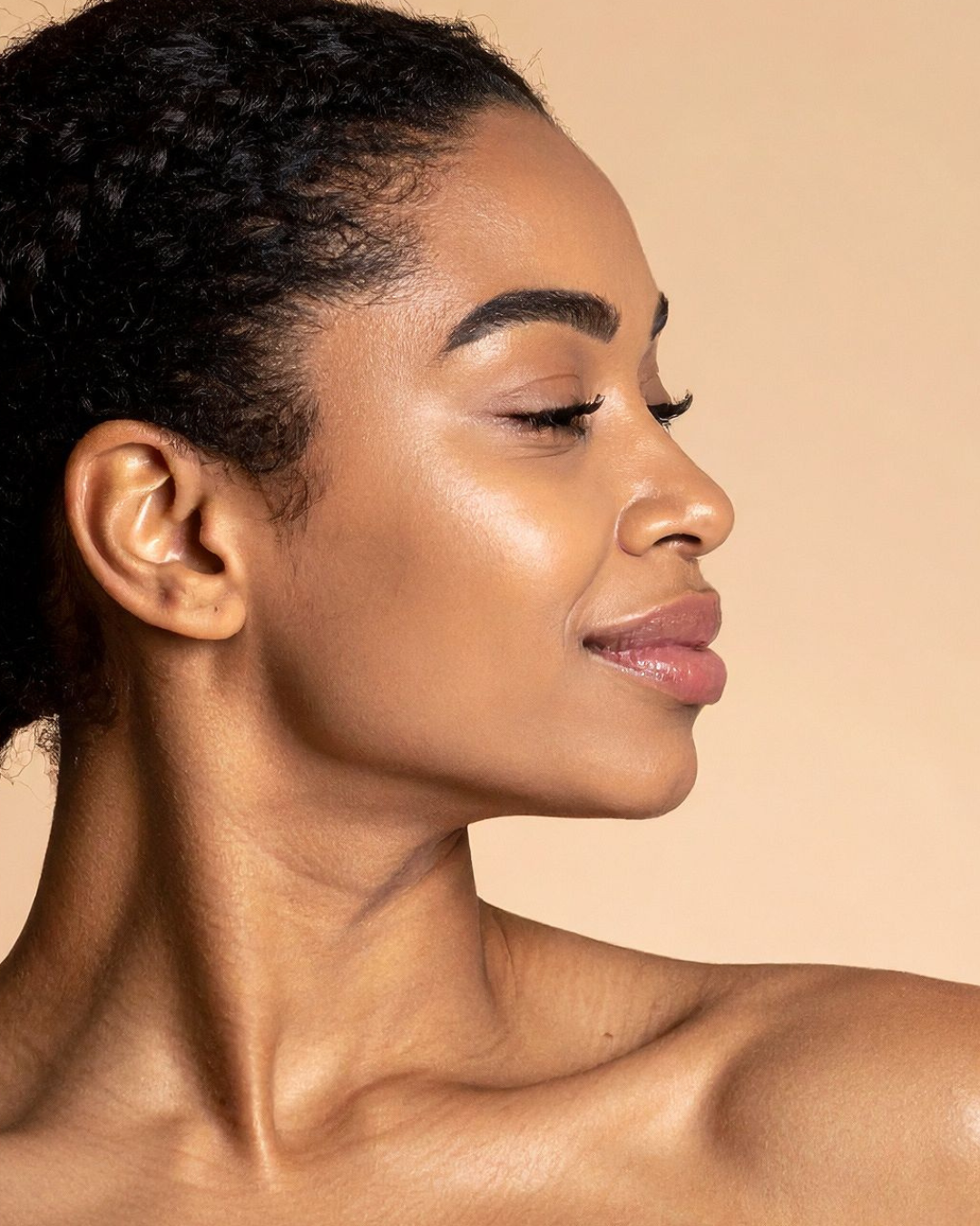 Close-up of a woman's face with a neutral background