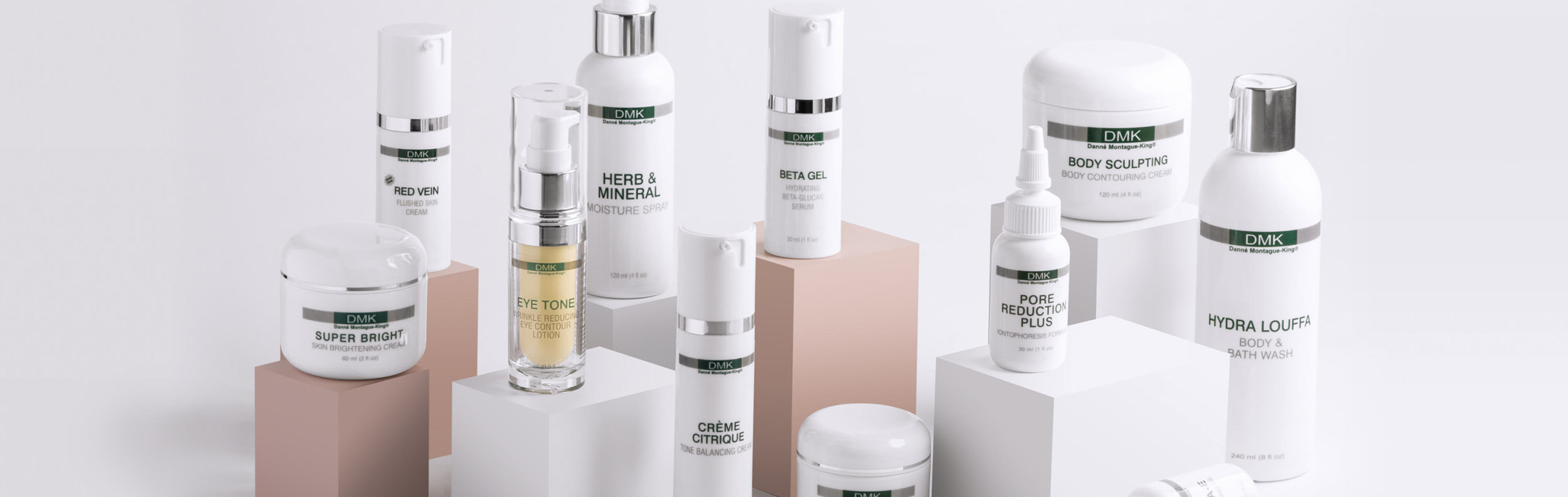 Collection of DMK skincare products on a white background