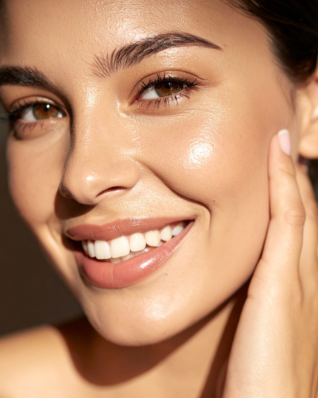 Close-up of a woman's face with a soft focus on her skin texture.